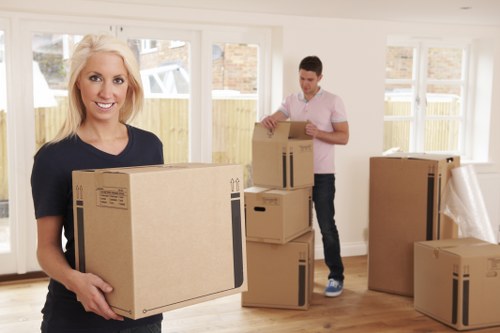 Professional movers loading furniture for a quick relocation