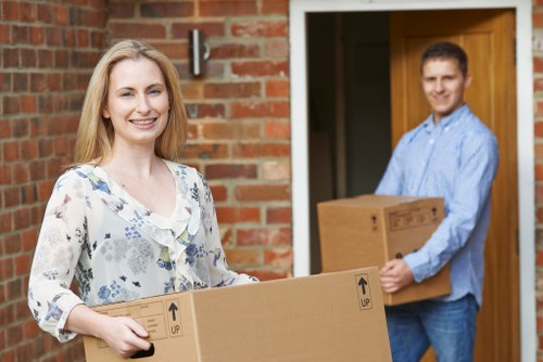 Mover wearing PPE while loading items
