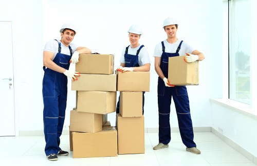 Removal team sorting recyclable packing materials for a Southwark move
