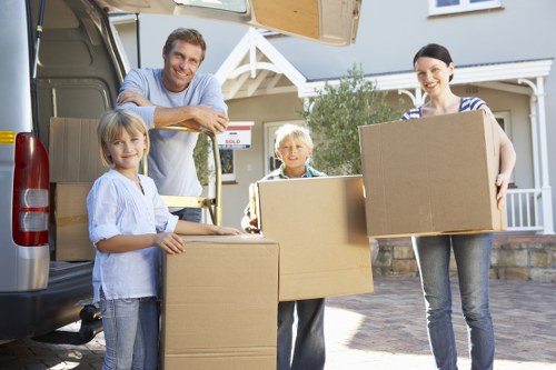 Trained removal staff handling furniture with care