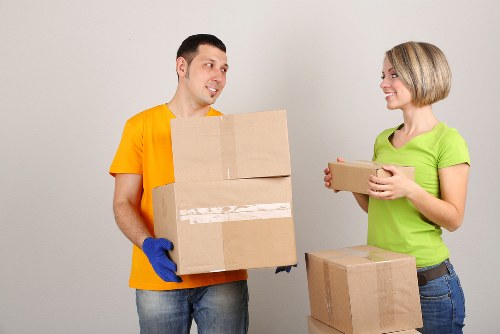 Professional movers handling furniture in a Southwark relocation